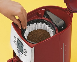 Loading the drip coffee machine with grounds