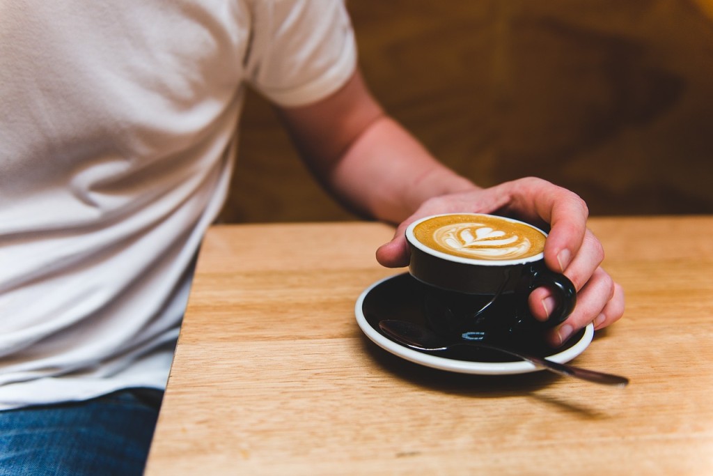 Coffee lover enjoying latte